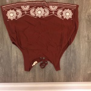 Dark colored open back crop top.